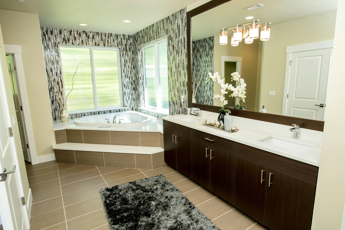 stylish bathroom with a corner bathtub and windows behind it